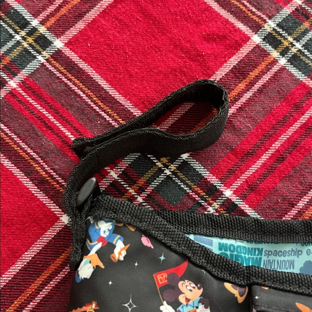 Disney Parks Stroller Organizer featuring an allover character print. GUC